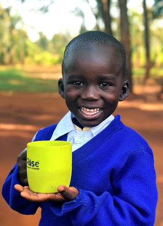 A student with a Rise Against Hunger meal.