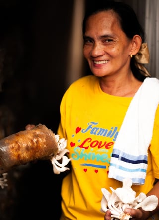 A woman serving food. 