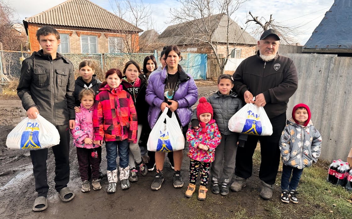 The Ivanenko family receiving necessary food, drinks and hygiene necessities. 