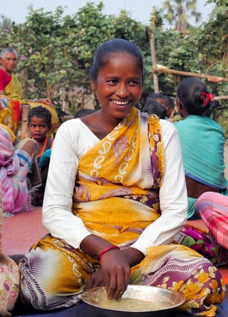A woman with a bowl of rice.