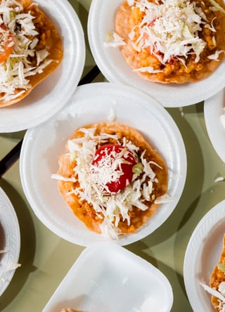 Tacos prepared with Rise Against Hunger meal packages.